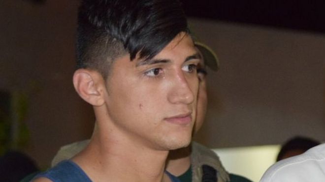 Mexican soccer player Alan Pulido, left, stands next to Tamaulipas Governor Egidio Torre Cantu after Pulido was rescued from kidnappers on 30 May