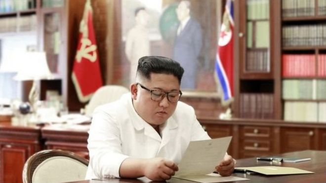 Kim was pictured reading the letter