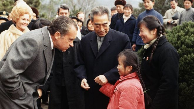 President Richard Nixon and First Lady Pat Nixon meet a Chinese girl in West Lake Park, China.