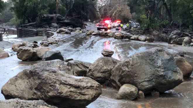 Boulders block a road after a mudslide in Montecito, California