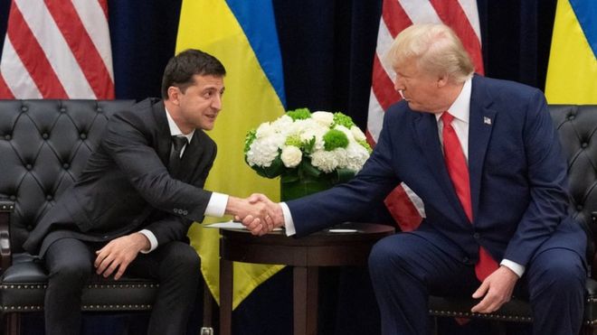 Ukraine's President Volodymyr Zelensky and US President Donald Trump shake hands during a meeting in September