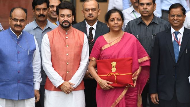 Indian Finance Minister Nirmala Sitharaman (2R) with Minister of State for Finance Anurag Thakur (2L) presents Union Budget 2019 on July 5, 2019.