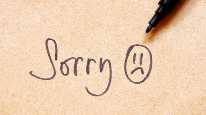 handwritten note saying sorry