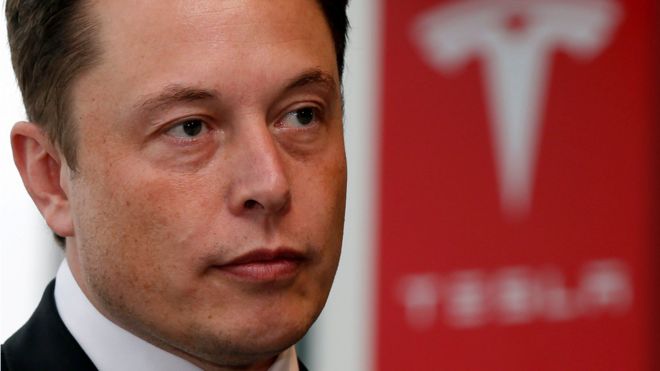 Tesla Motors Inc Chief Executive Elon Musk pauses during a news conference in Tokyo September 8, 2014.