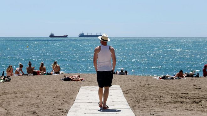 Visitors enjoy the beaches in Malaga, Spain