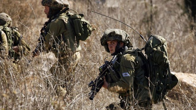 Israeli soldiers patrol near border with Lebanon
