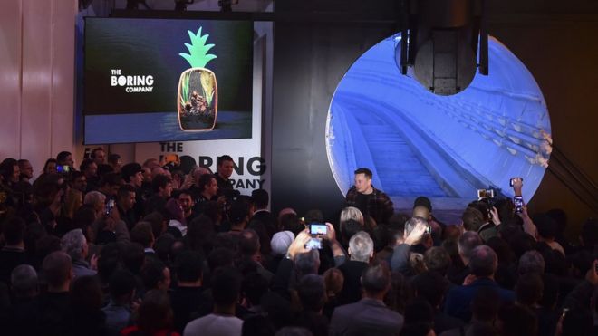 Elon Musk unveils test tunnel in Hawthorne, south of Los Angeles, California on December 18, 2018.