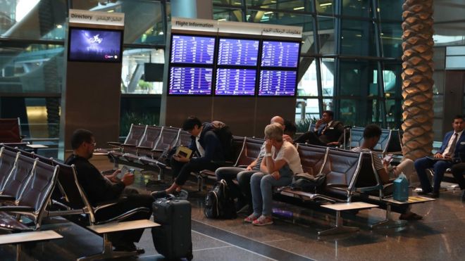 Passengers wait at Hamad International Airport in the Qatari capital Doha on 12 June 2017.
