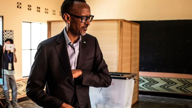 Rwandan President Paul Kagame arrives to cast his vote at a polling station in Kigali, 4 August