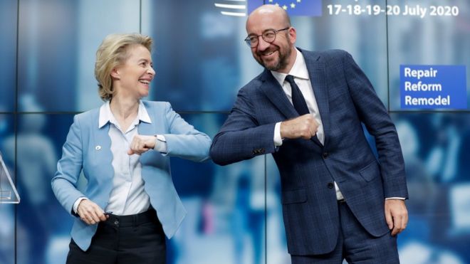 European Council President Charles Michel and European Commission President Ursula Von Der Leyen do an elbow bump at the end of a news conference following a four-day European summit at the European Council in Brussels, Belgium, July 21, 2020.