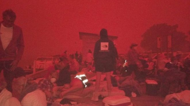 People in Mallacoota evacuated to the beaches under a deep-red sky