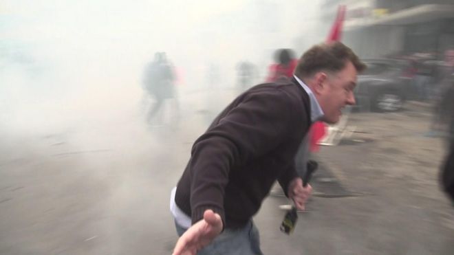 BBC correspondent Martin Patience flees tear gas
