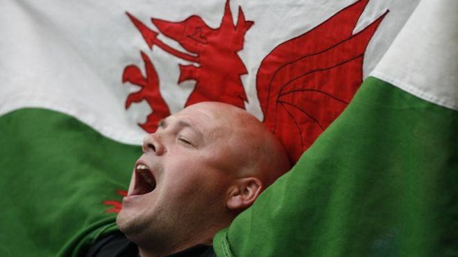 A Cardiff City fan singing and enjoying the day with his Welsh dragon flag during the 2008 FA Cup Final between Portsmouth and Cardiff City at Wembley Stadium in London, England, UK. (Photo by ben radford/Corbis via Getty Images)