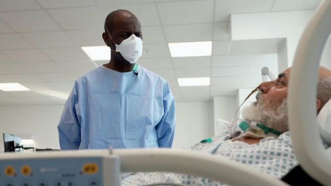 Clive Myrie and a Covid patient the Royal London Hospital