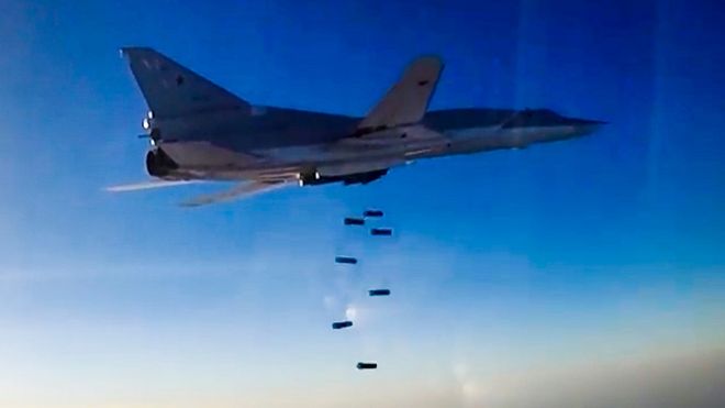 A still image, taken from video footage released by the Russian Defence Ministry on 16 August 2016, shows a Russian Tupolev Tu-22M3 long-range bomber based in Iran dropping bombs on an unknown location in Syria
