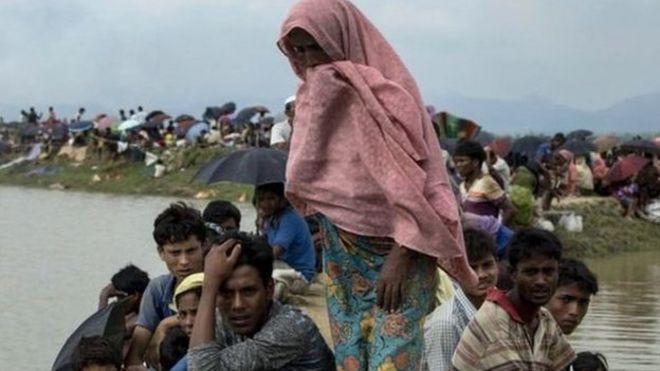 Rohingya families are making their way across the Naf River into Bangladesh