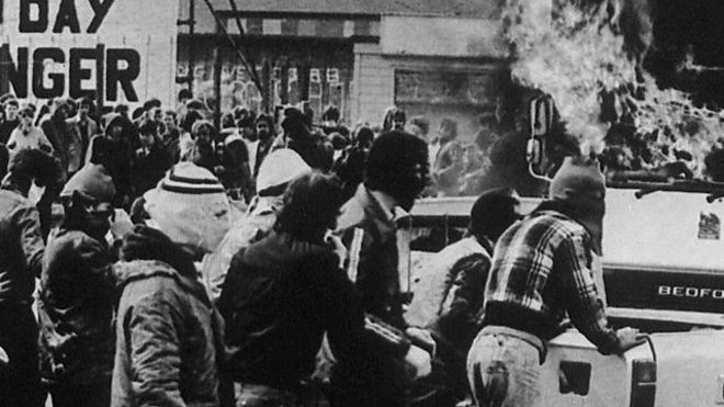 Protestors wearing balaclavas in support of the hunger strike