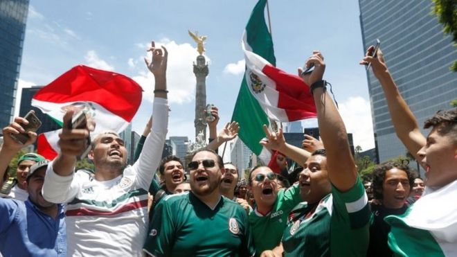 Soccer Football - FIFA World Cup - Group F - Germany v Mexico - Mexico City, Mexico - June 17, 2018 - Mexican fans celebrate at the Angel of Independence monument.