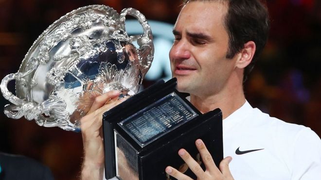 Roger Federer holds the Australian Open trophy