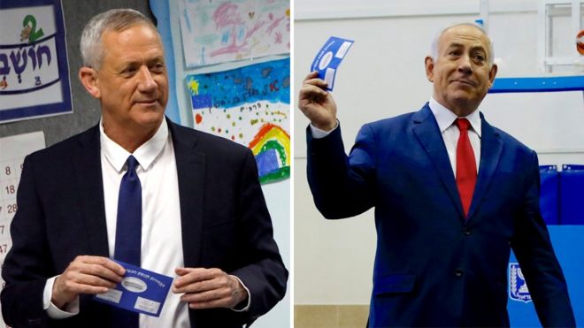 Benny Gantz (L) and Benjamin Netanyahu (R) vote in Israel's general election (9 April 2019)