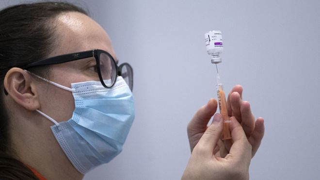 A member of the vaccine team prepares a syringe with a dose of the AstraZeneca/Oxford Covid-19 vaccine, at an NHS Scotland vaccination centre set up at the Edinburgh International Conference Centre (EICC) in Edinburgh on February 1, 2021.