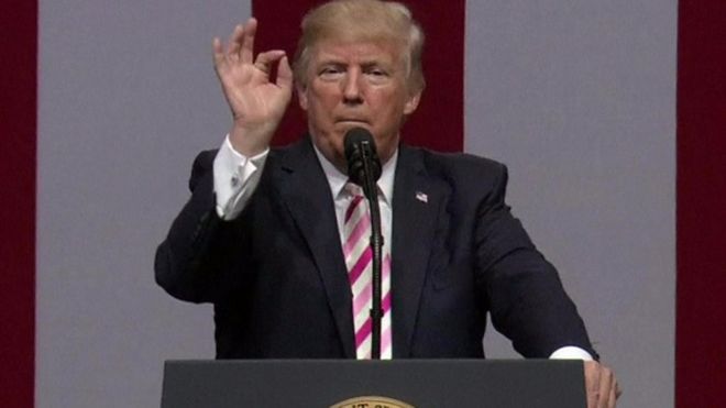 Donald Trump gestures at the camera