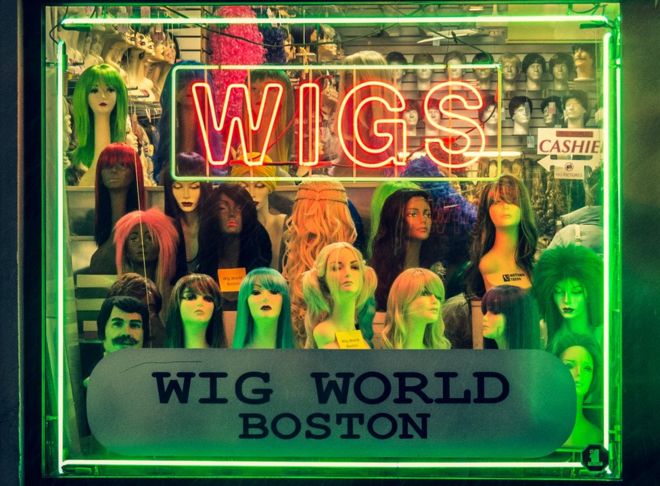 A window display of wigs