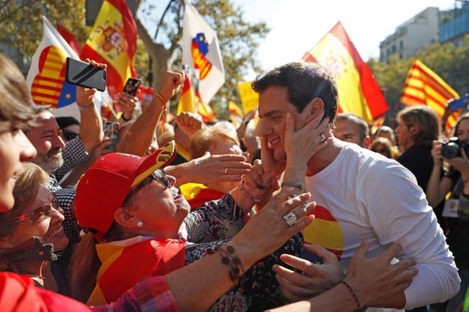 Ciudadanos (Citizens) leader Albert Rivera (R) is greeted by supporters in Barcelona, 27 October