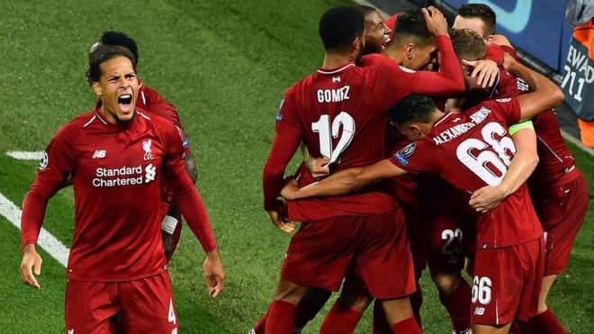 Liverpool's players celebrate scoring against Paris St-Germain