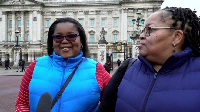 Two women outside Buckingham Palace