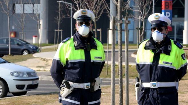 Police on guard at the hospital of Schiavonia, near Padova, where tests for the coronavirus are performed in Veneto region