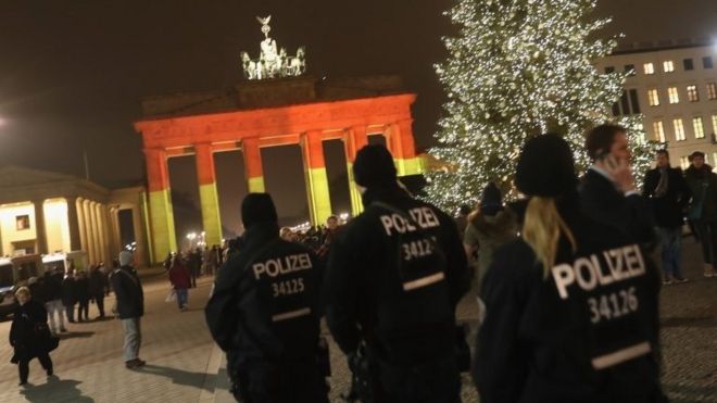 Police in front of Berlin's Brandenburg Gate following the lorry attack on a Christmas market which left 12 people dead on 19 December 2016