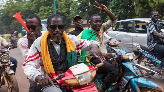 People on motorbikes in Bamako celebrating the military takeover in Mali - 19 August 2020