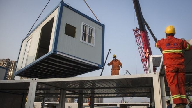A prefabricated building is lowered at Huoshenshan Hospital