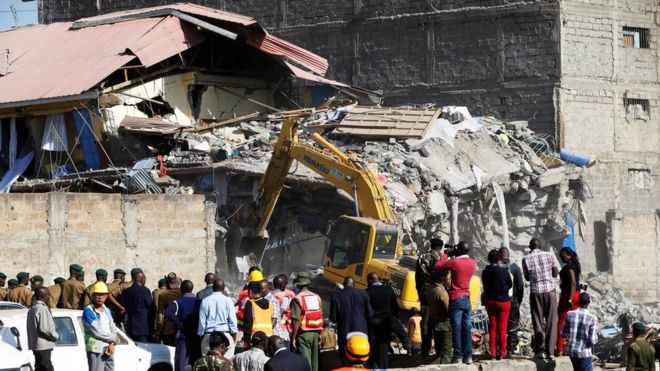 Rescue workers at the scene after a building collapsed in a residential area of Nairobi, 13 June 2017
