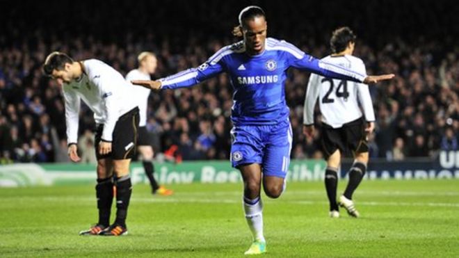 Former Chelsea midfielder Didier Drogba, left, holds his Shanghai