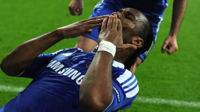 Former Chelsea midfielder Didier Drogba, left, holds his Shanghai