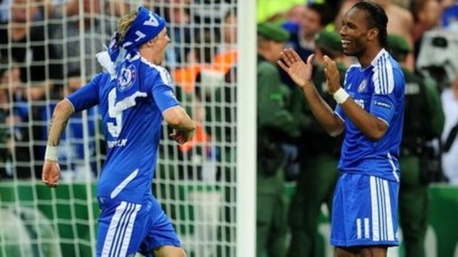 Former Chelsea midfielder Didier Drogba, left, holds his Shanghai