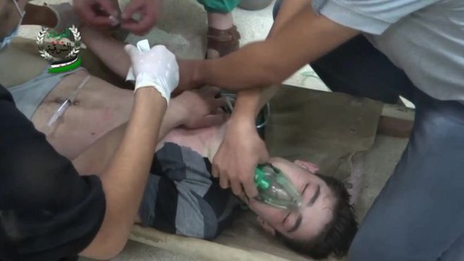 Man wears oxygen mask in still from amateur footage