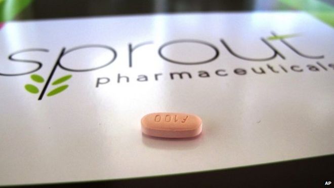 A tablet of flibanserin sits on a brochure for Sprout Pharmaceuticals