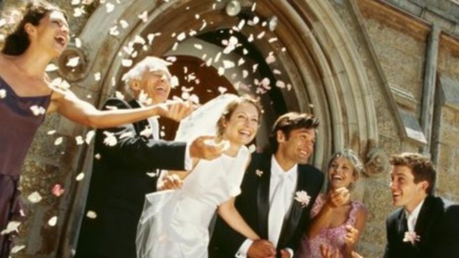 Happy couple emerge from chapel