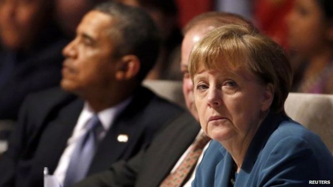 Президент США Барак Обама и канцлер Германии Ангела Меркель (слева направо) на открытии саммита по ядерной безопасности в Гааге 24 марта 2014 года
