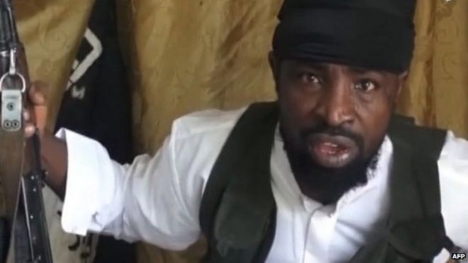 Снимок экрана, снятый 24 марта 2014 года из видео, полученного AFP, на котором изображен лидер «Боко харам» Абубакар Шекау