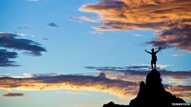 climber on top of mountain