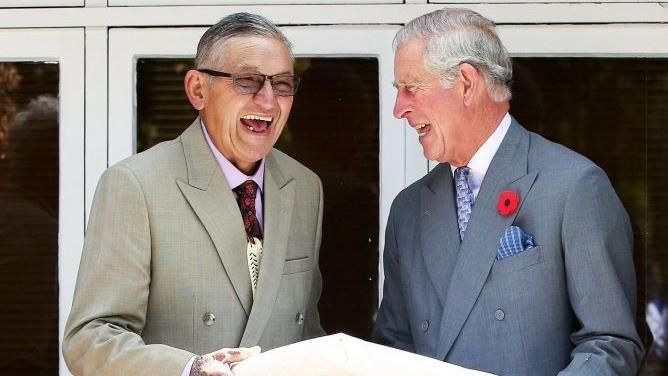 Then-Prince Charles and King Tuheitia laugh as they exchange a gift 