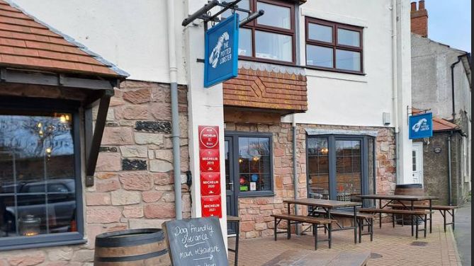 A picture of the outside of the Potted Lobster- a restaurant in Bamburgh