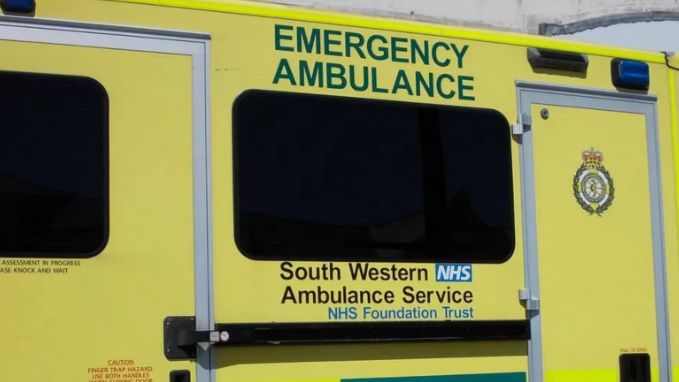The side of a yellow SWAST ambulance