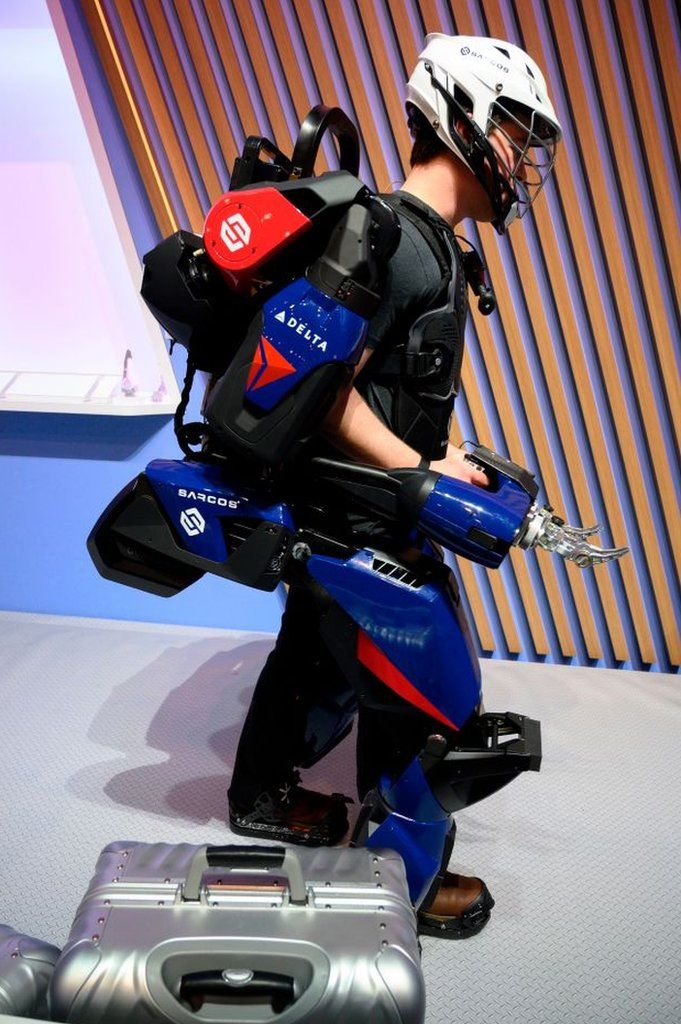 A man trying out Sarcos Robotics' exoskeleton