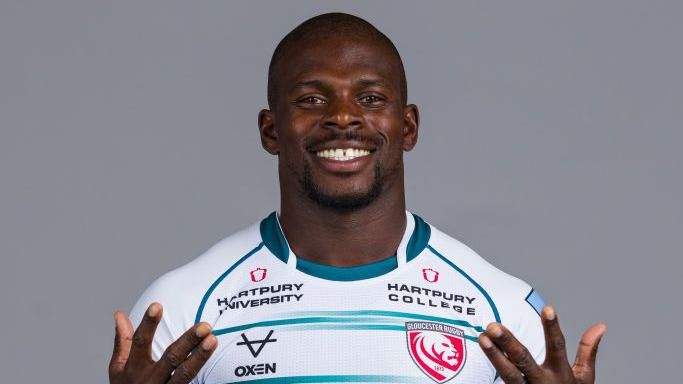 Christian Wade standing for a team photo for Gloucester