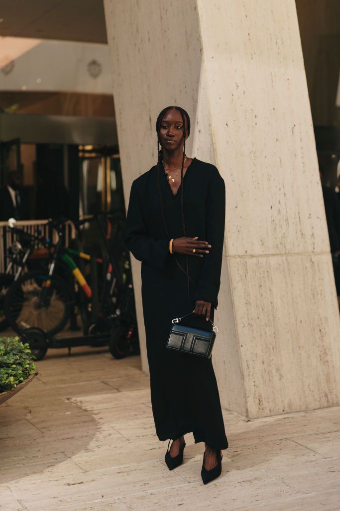 Street style shot of a woman dressed in black at New York RTW Fashion Week on 10 September. 